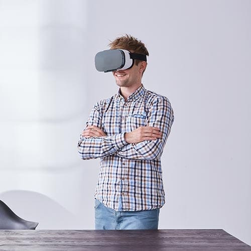 A man uses virtual reality glasses