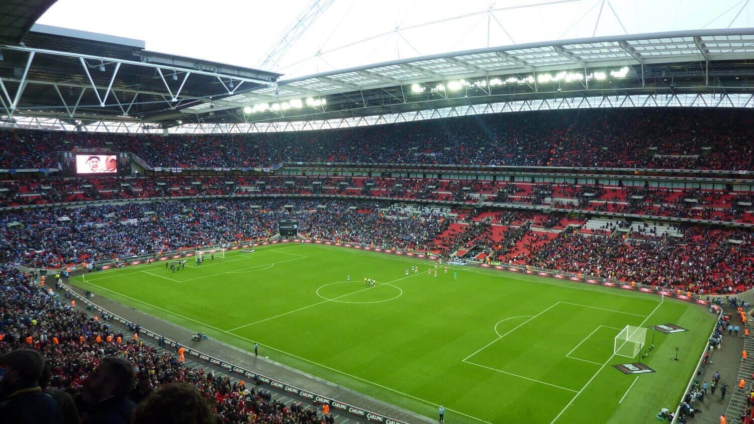 The Wembley Stadium is packed with football fans right before the match starts